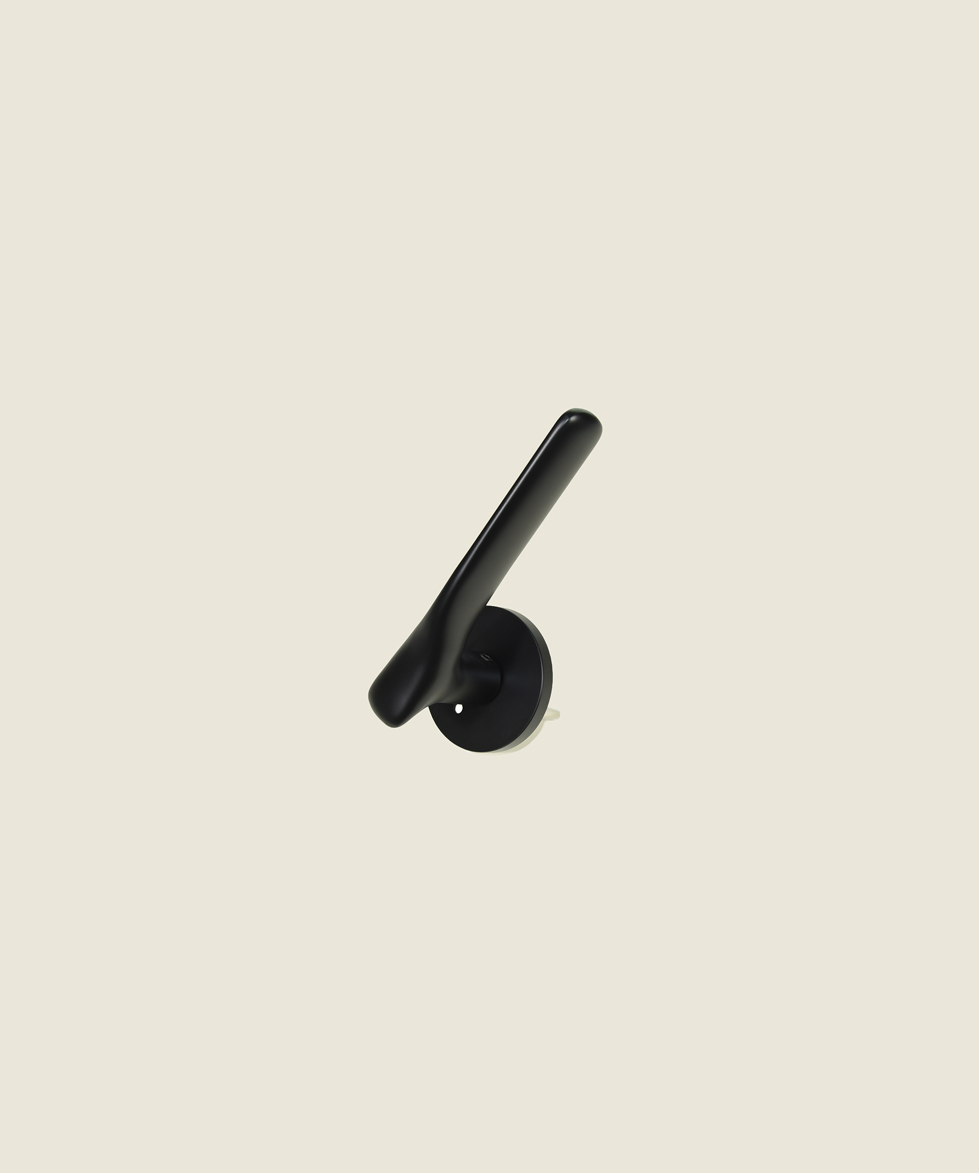 The Gaudi Curve close-up detail - matte black curved brass door lever with smooth sculptural finish