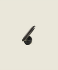 The Matisse Silhouette Black - matte black brass door lever with slim curved form and circular rose
